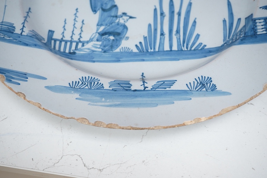 An 18th century English delftware plate, 34cm